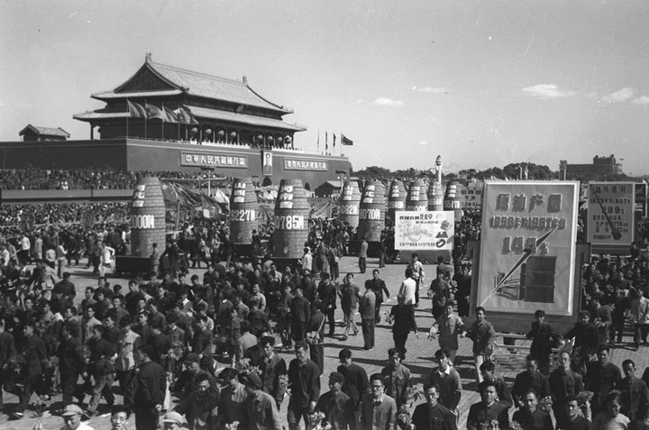 Peasants and workers celebrate 1958 production numbers on the Avenue of Eternal Peace, Beijing.